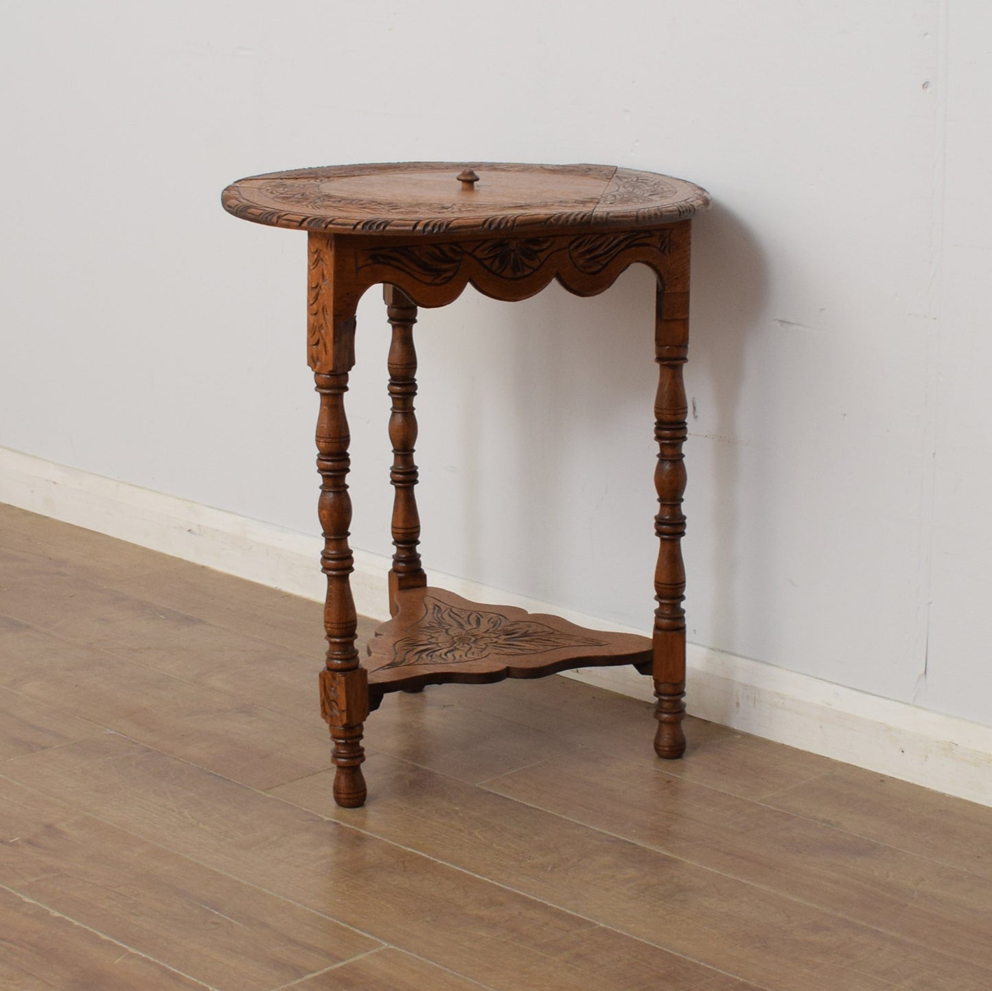 Carved Swivel-Top Side Table