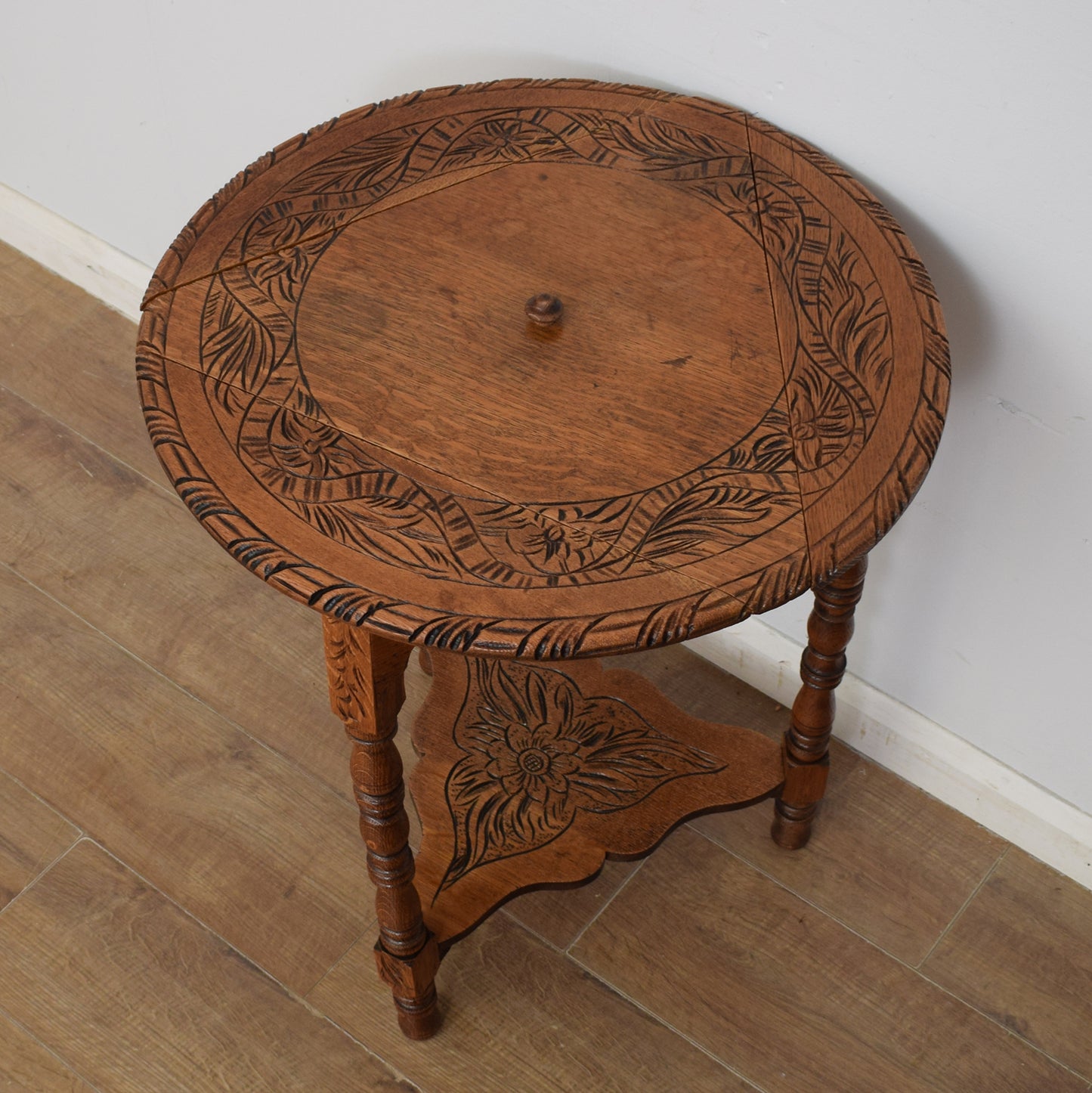 Carved Swivel-Top Side Table