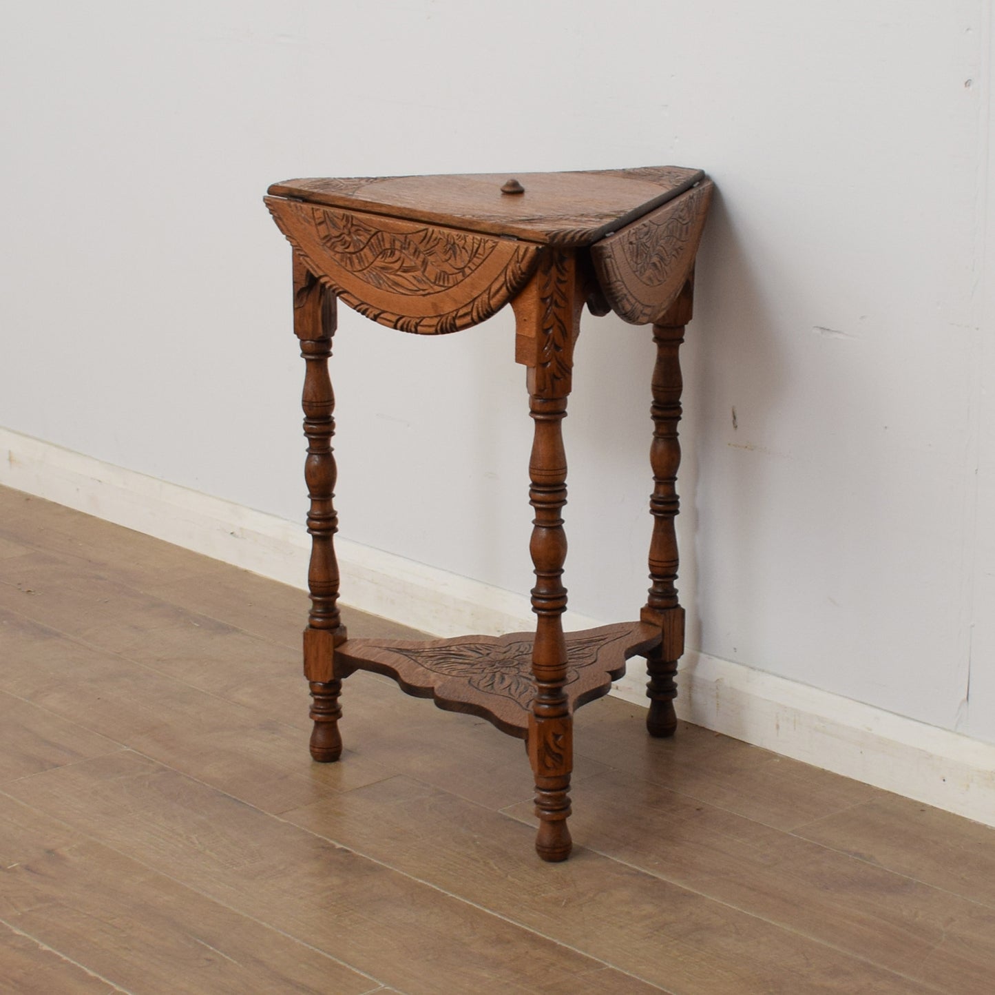 Carved Swivel-Top Side Table