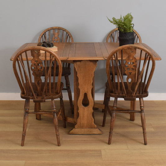 Drop-Leaf Table with Four Wheel-Back Chairs