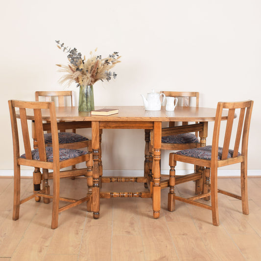 Oak Drop-Leaf Table with Four Chairs