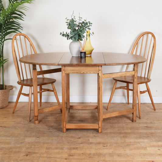 Ercol Drop-Leaf Table and Two Chairs