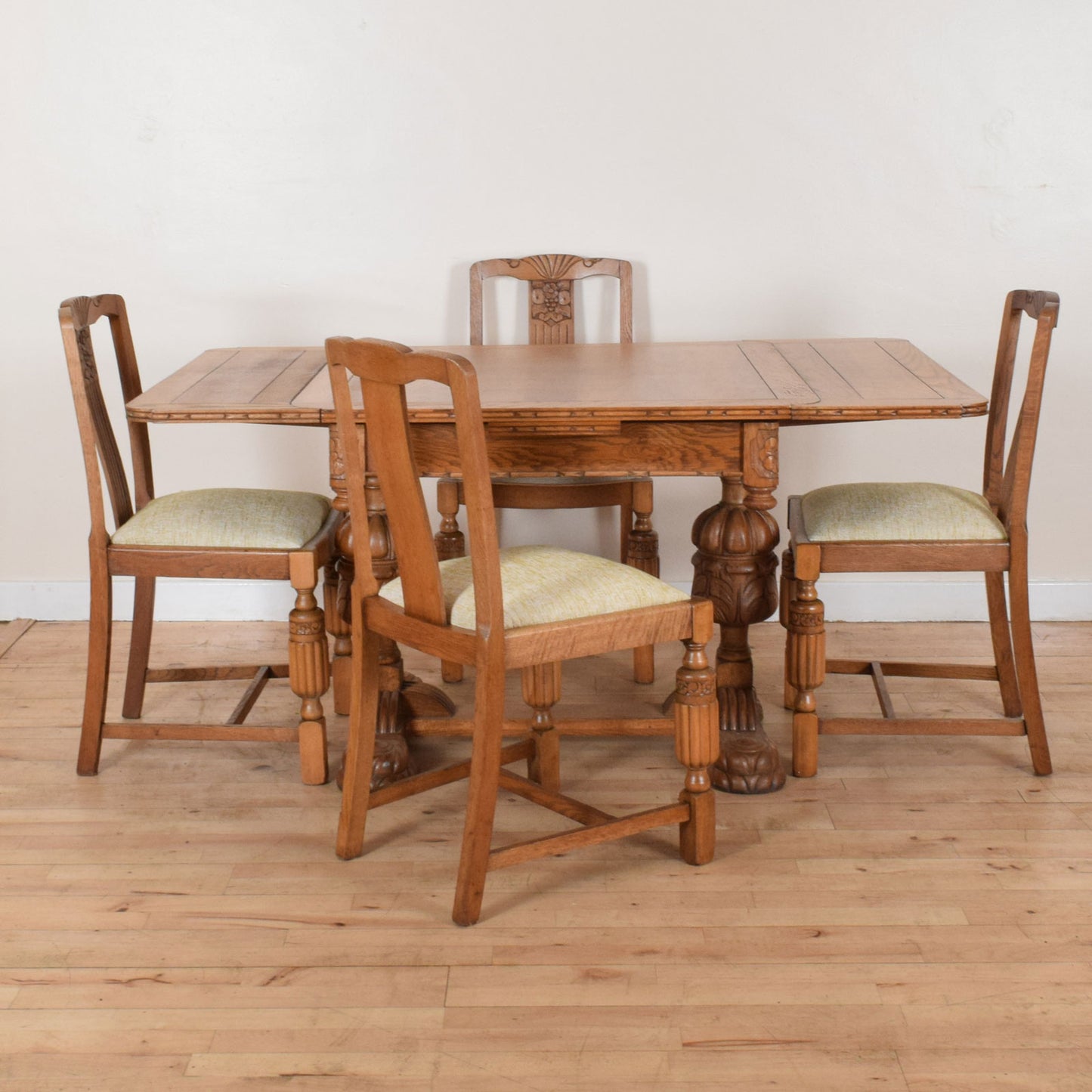 Carved Oak Draw Leaf Table and Four