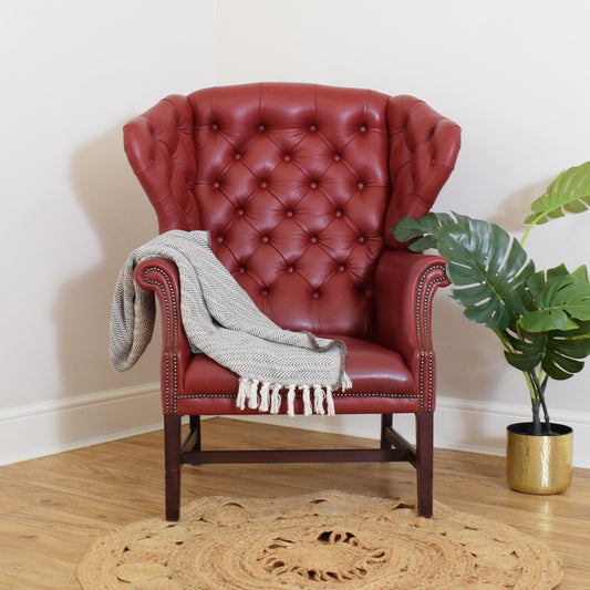 Red‘Chesterfield’ wing-back chair